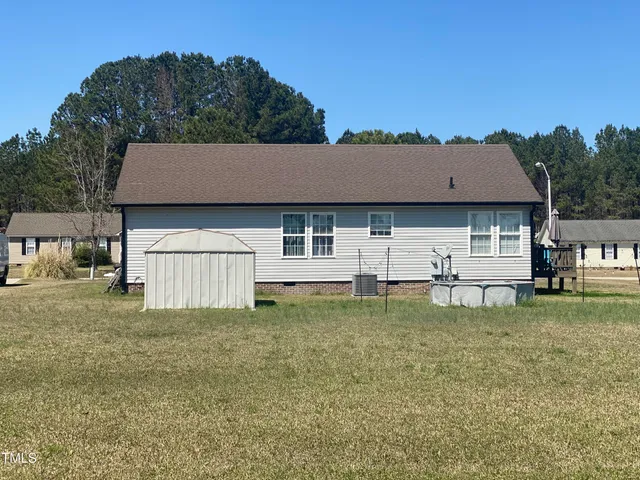 a view of a porch with wooden floor