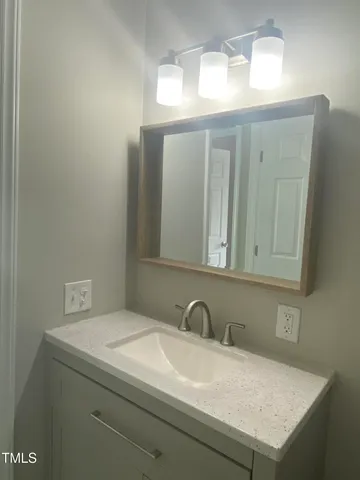 a view of an empty room and closet area