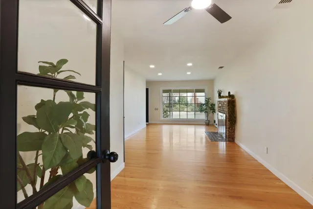 a view of an entryway with wooden floor