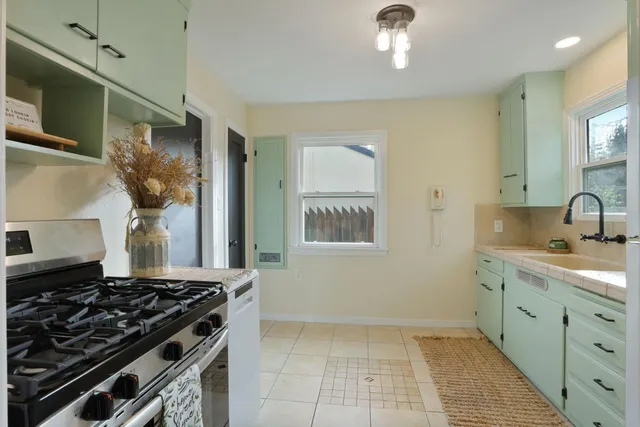 a kitchen with a stove and a sink