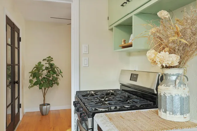 a view of a livingroom with a ceiling fan and window