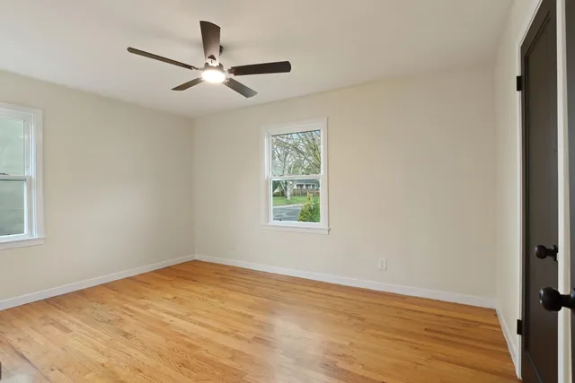 a bathroom with a sink and mirror with toilet