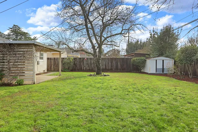 an aerial view of a house with outdoor space