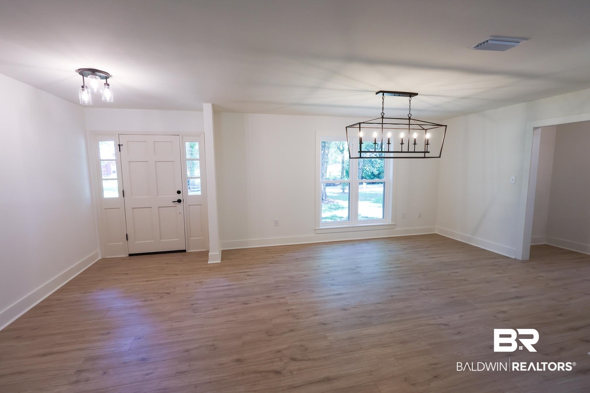 12190 Pecan Grove Street Magnolia Springs, AL 36555 - Photo 9 of 45 Foyer with an inviting chandelier and hardwood / wood-style flooring