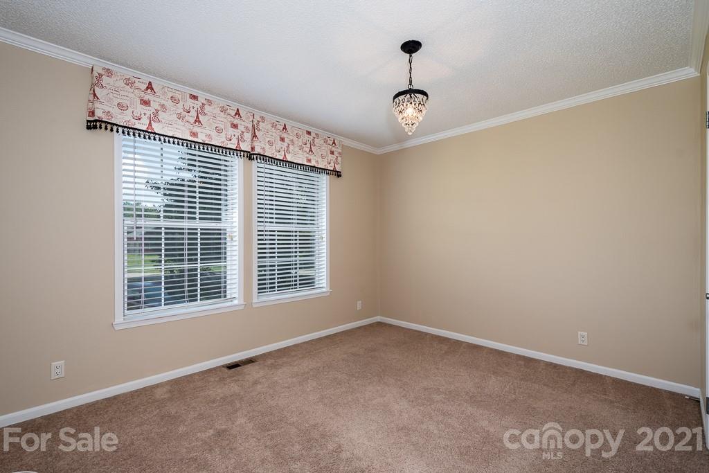 6621 Love Point Road Denver, NC 28037 - Photo 22 of 26 a view of an empty room with a window