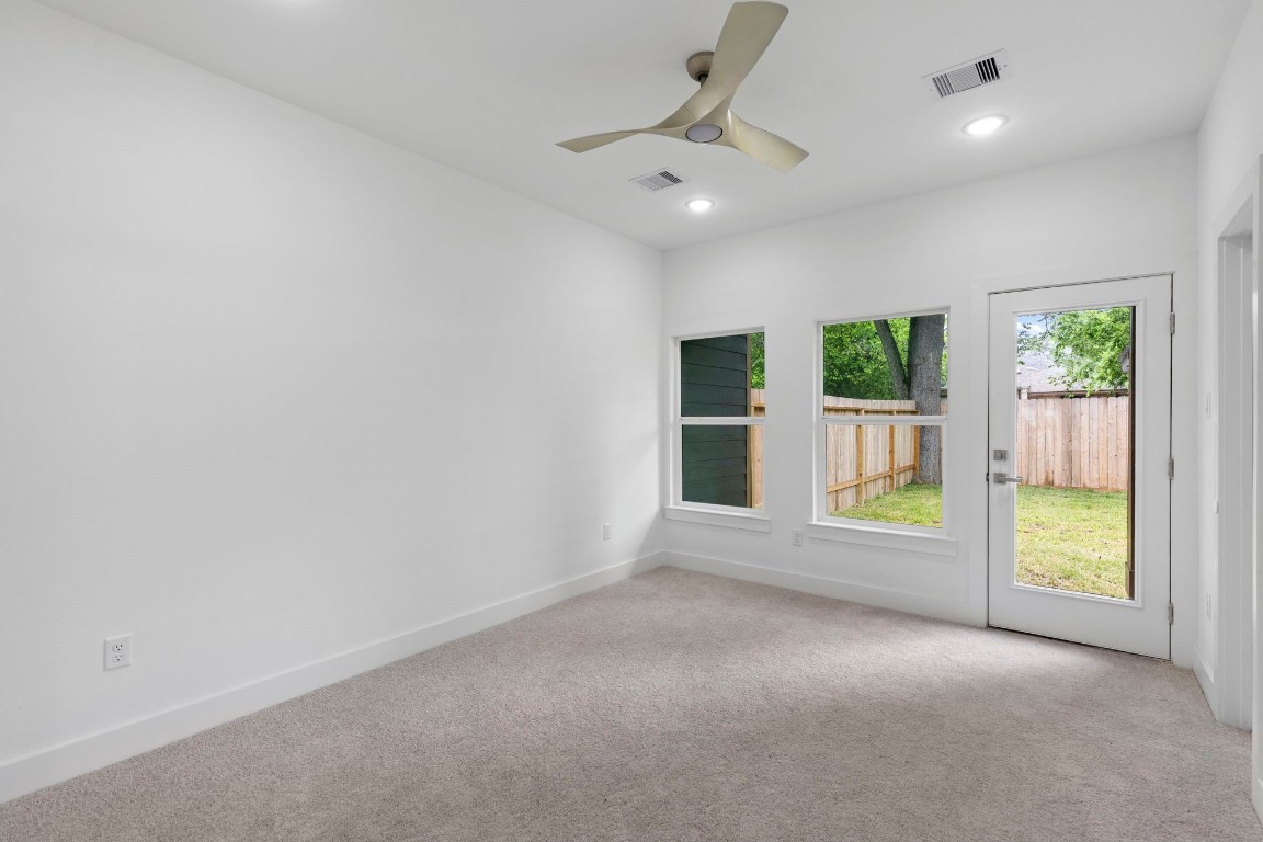 8109 Hamlet Street, Unit B Houston, TX 77078 - Photo 11 of 21 an empty room with windows and outdoor view