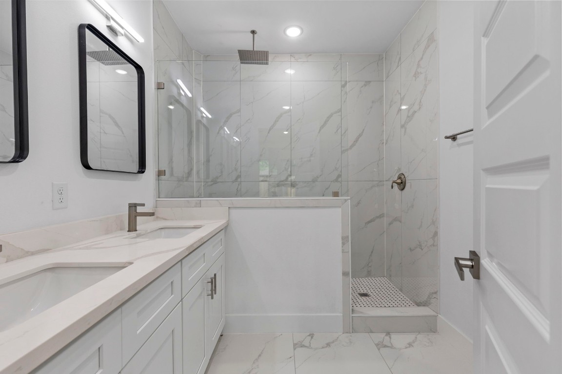 8109 Hamlet Street, Unit B Houston, TX 77078 - Photo 14 of 21 a bathroom with a shower sink and mirror