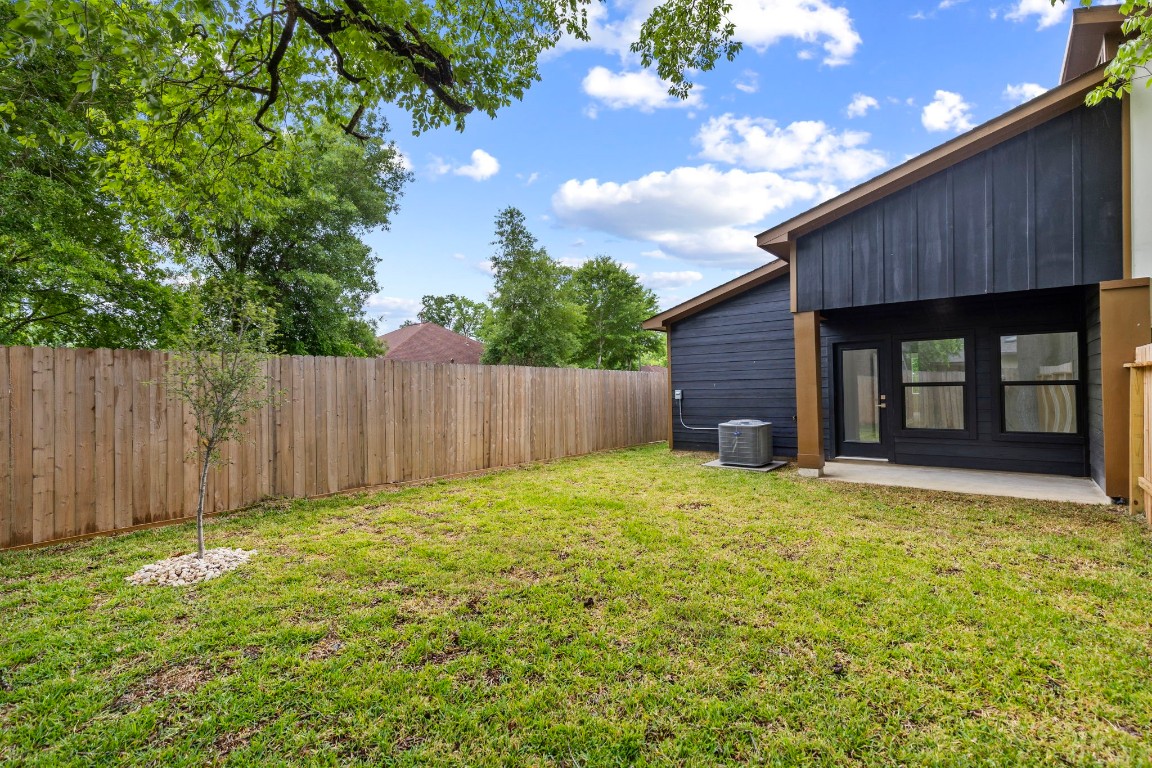 8109 Hamlet Street, Unit B Houston, TX 77078 - Photo 15 of 21 a view of backyard with wooden fence and large trees