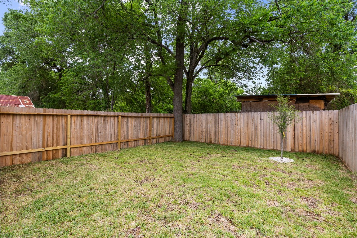 8109 Hamlet Street, Unit B Houston, TX 77078 - Photo 16 of 21 a view of a backyard with wooden fence