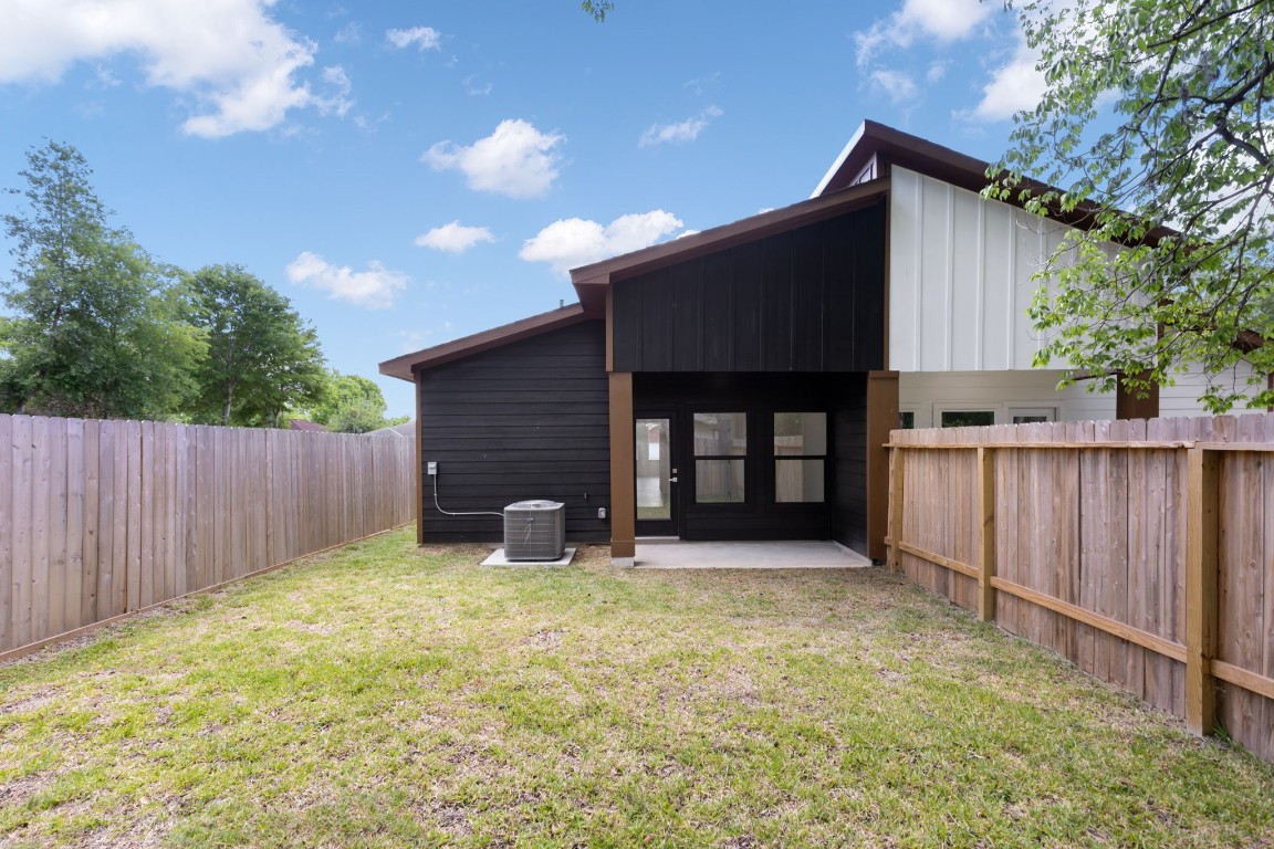8109 Hamlet Street, Unit B Houston, TX 77078 - Photo 17 of 21 a front view of house with yard and trees in the background