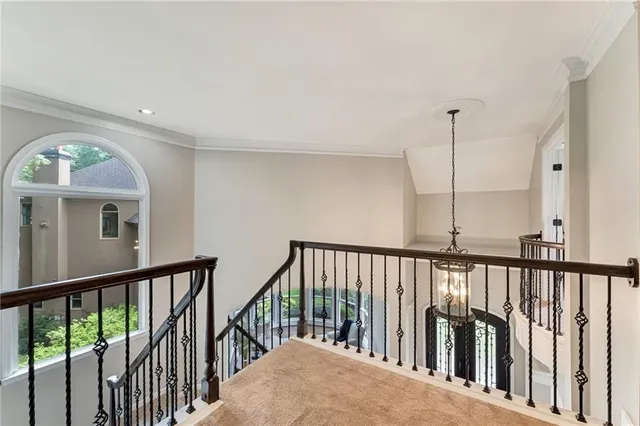 a view of staircase with wooden floor