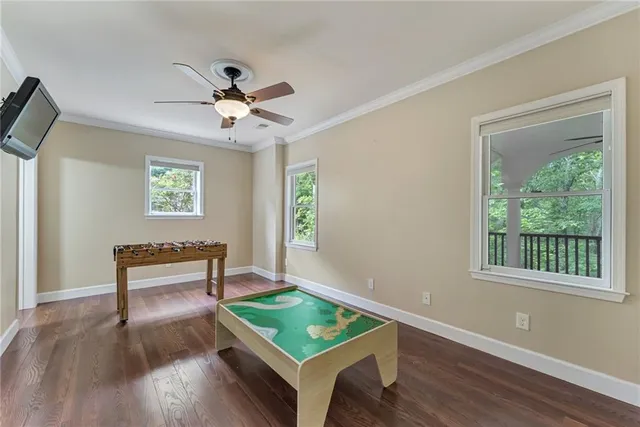 a bathroom with a granite countertop sink a toilet a mirror and shower