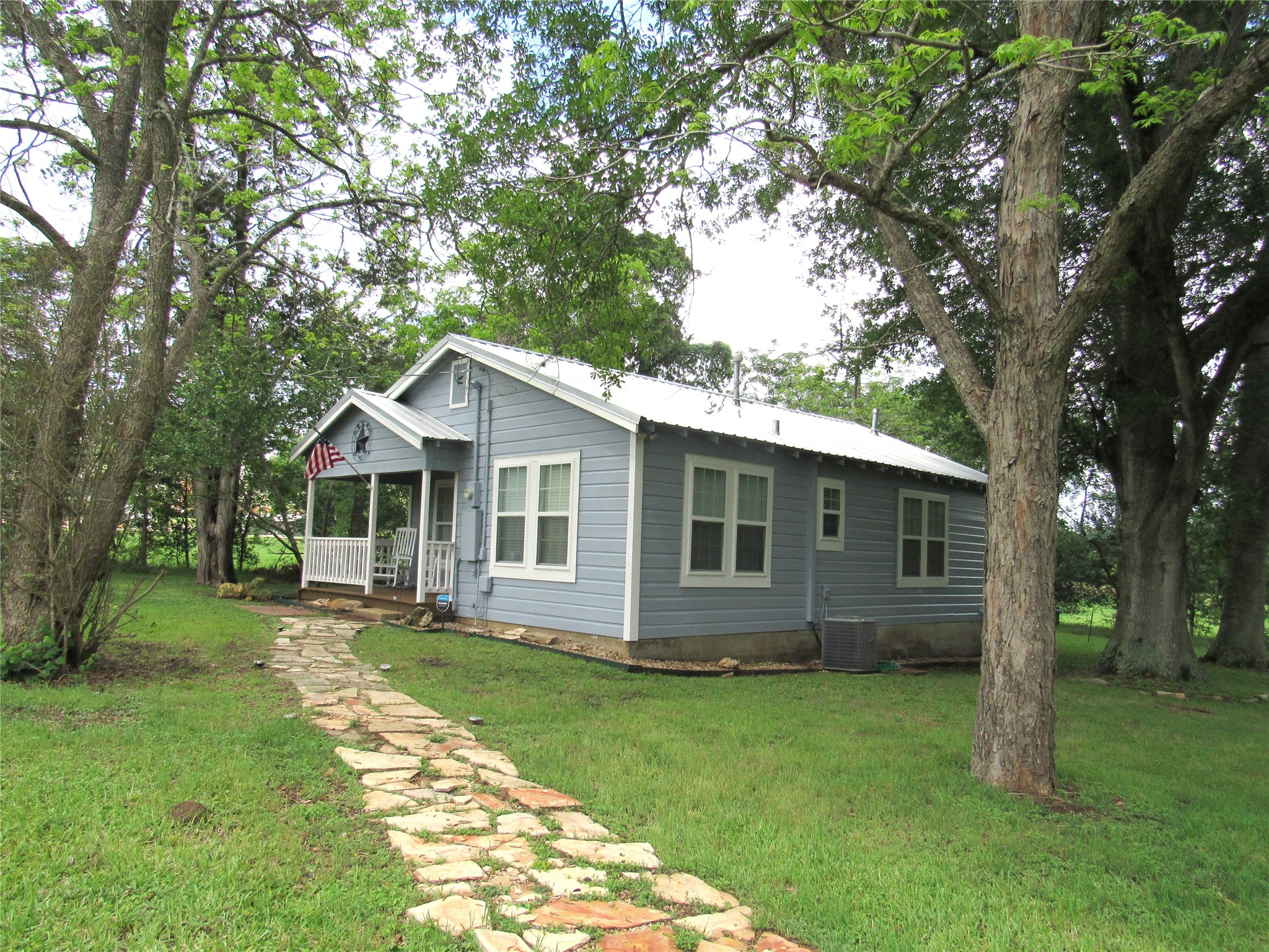 1013 Prairie Lea Street Brenham, TX 77833 - Photo 3 of 36 a front view of house with yard and green space