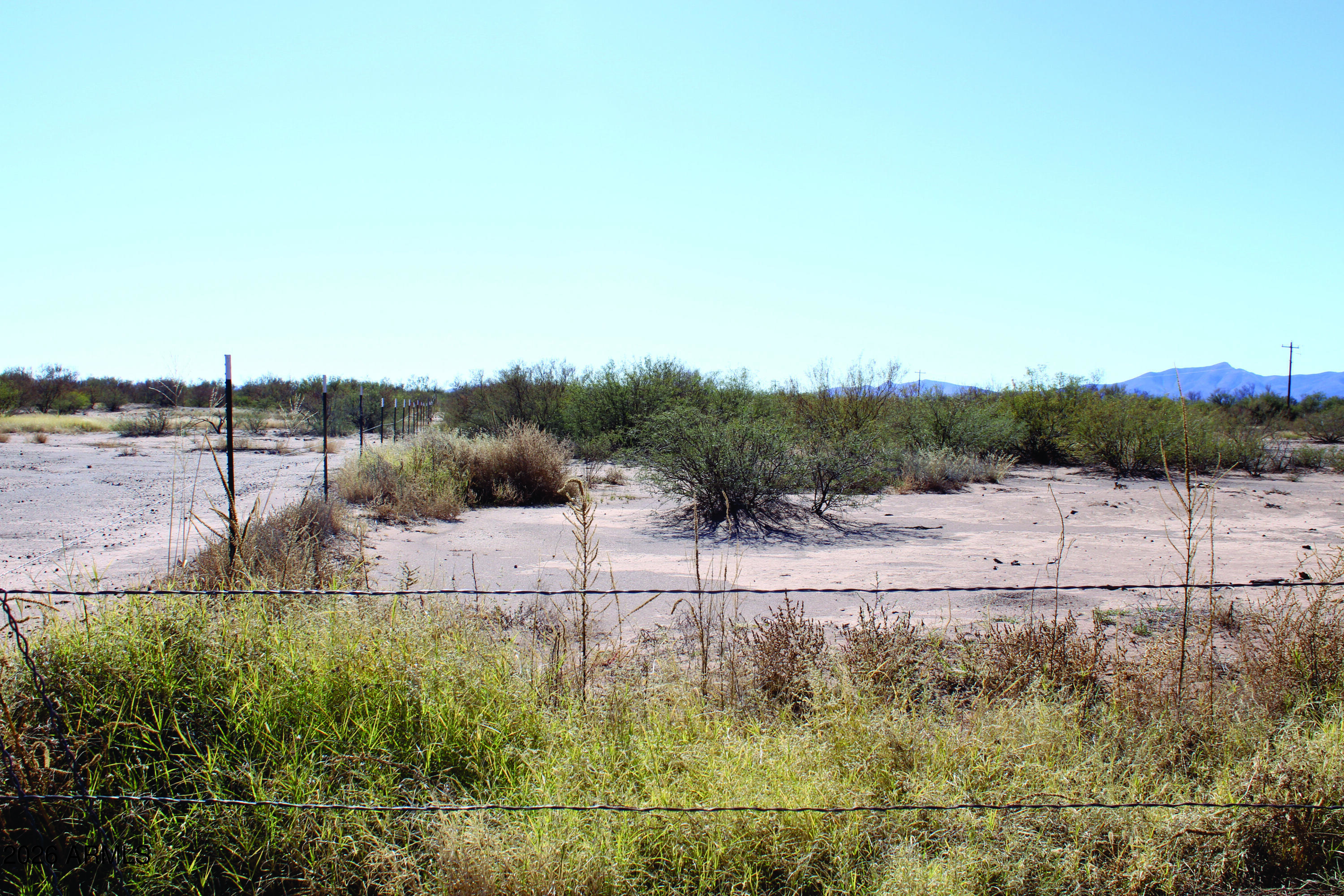 4.49-acres West Duke Road, Unit 2 McNeal, AZ 85617 - Photo 18 of 26 a view of a dry yard with wooden fence