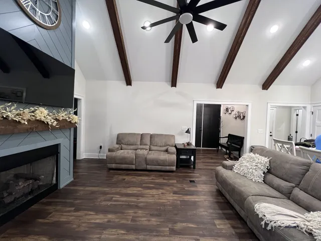 a large kitchen with stainless steel appliances kitchen island granite countertop a large island in the center