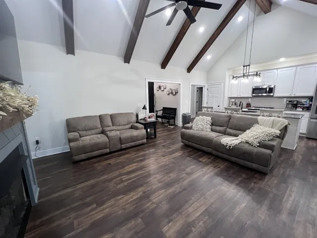 a dining room with furniture and wooden floor