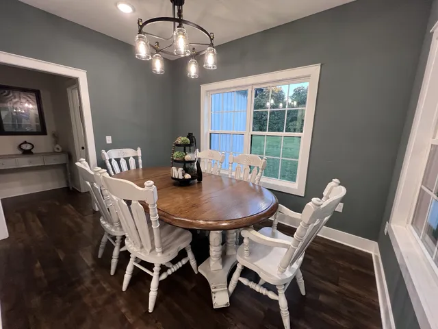 a bedroom with bed and wooden floor