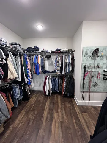 a bedroom with bed and window