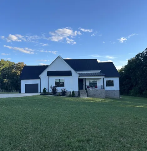 a house view with a garden space
