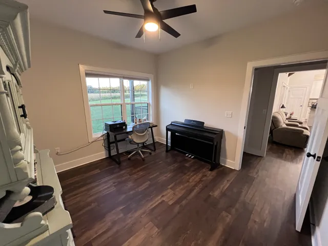 a bathroom with a granite countertop double vanity sink and mirror