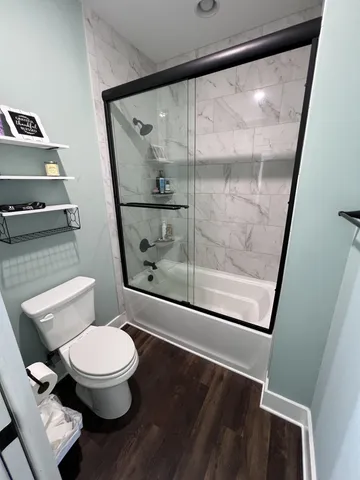 a view of a swimming pool with an outdoor seating