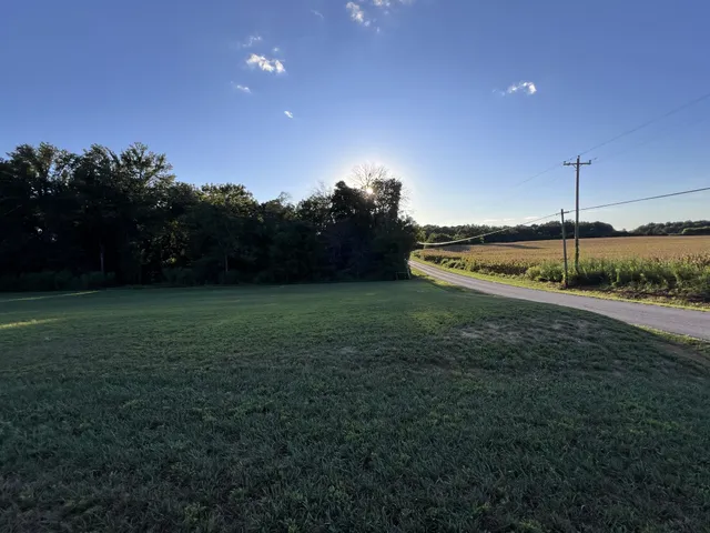 a front view of house with a yard and garage