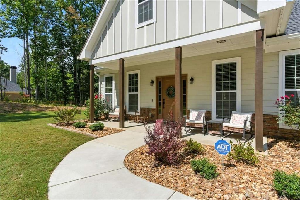 62 Joe Rowell Road Buchanan, GA 30113 - Photo 4 of 63 a view of a house with backyard sitting area and garden