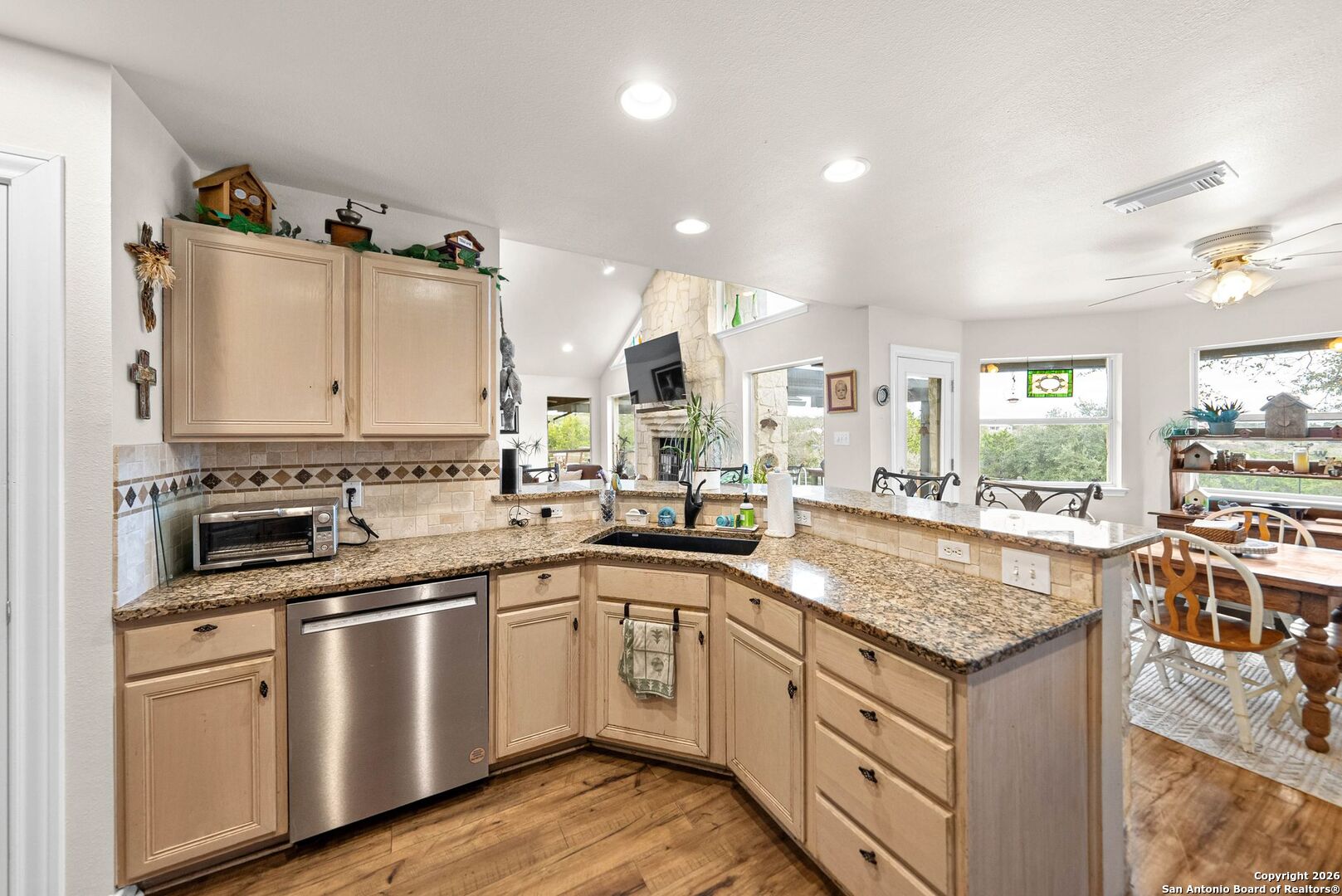 27150 Karsch Road Boerne, TX 78006 - Photo 13 of 79 a kitchen with granite countertop white cabinets and white appliances