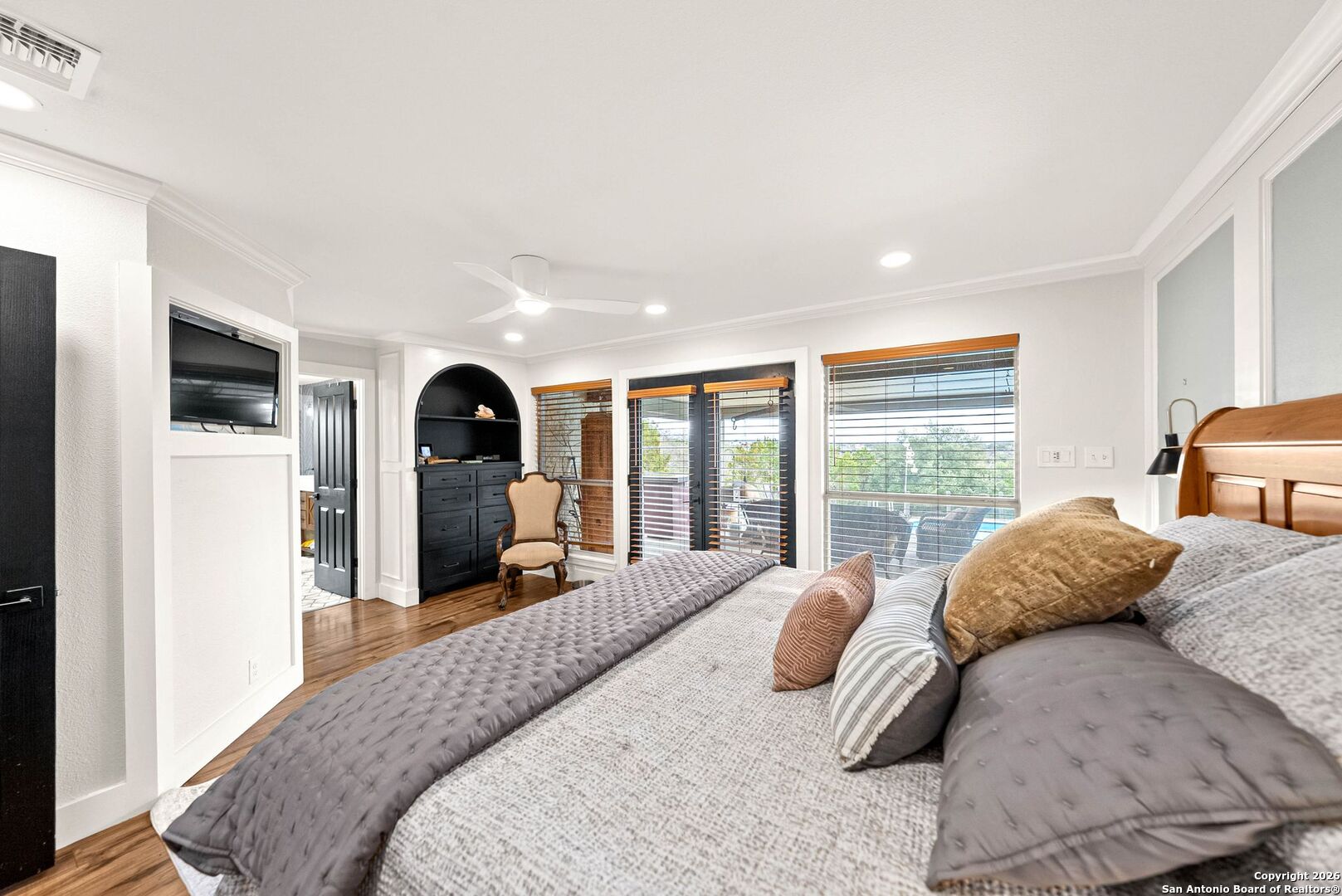 27150 Karsch Road Boerne, TX 78006 - Photo 24 of 79 a bedroom with a bed large window and couch