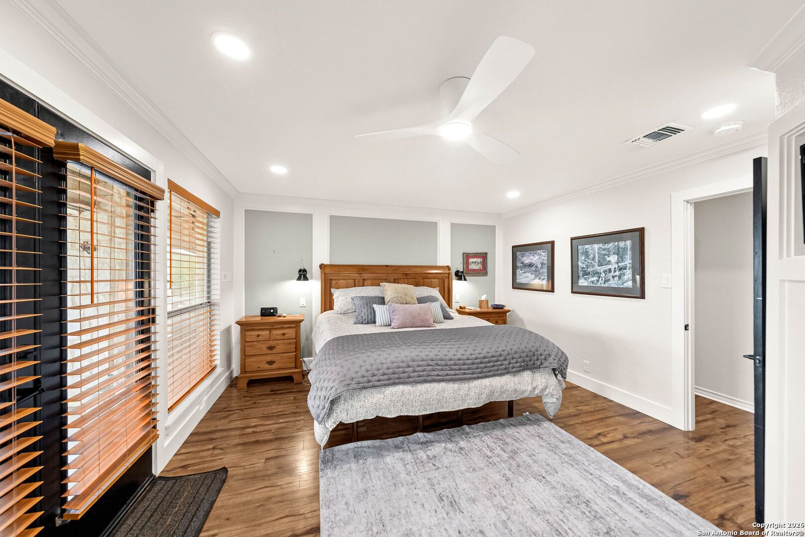 27150 Karsch Road Boerne, TX 78006 - Photo 25 of 79 a spacious bedroom with a large bed and a wooden floor