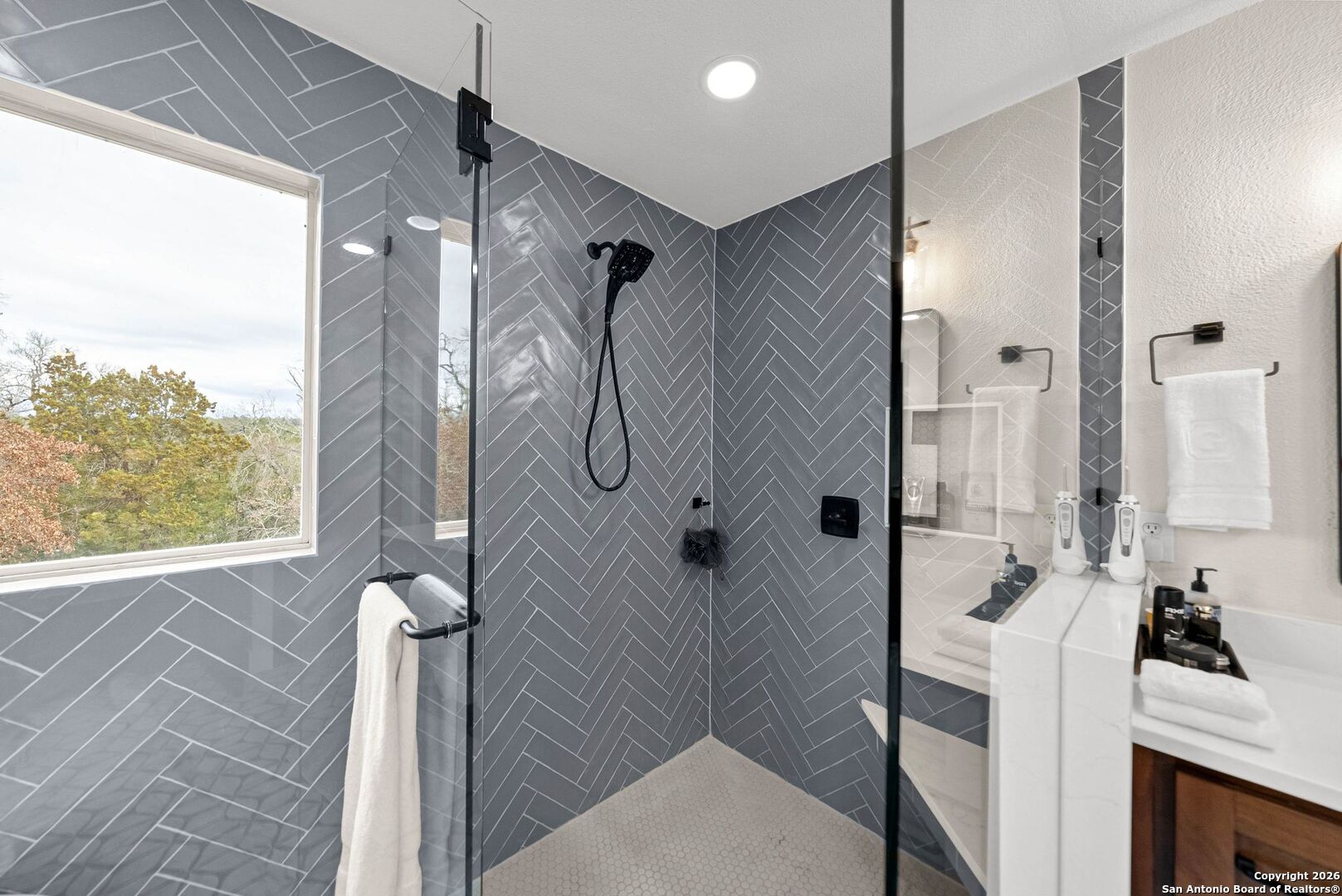 27150 Karsch Road Boerne, TX 78006 - Photo 30 of 79 a bathroom with a shower and a sink