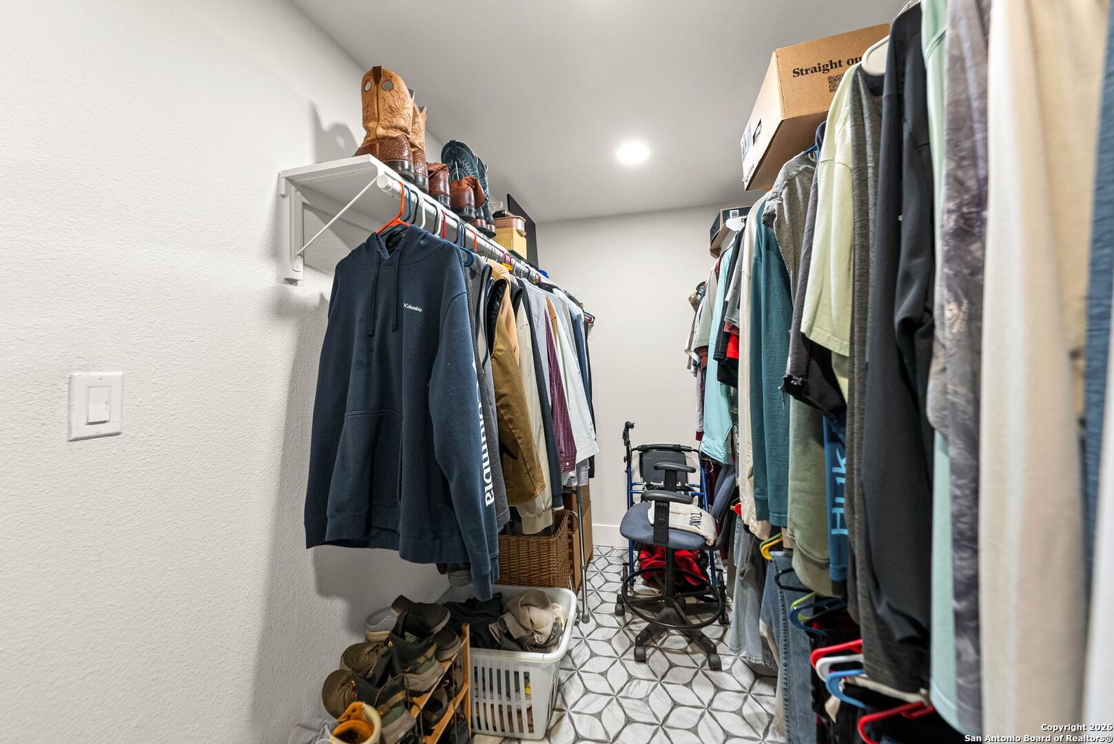 27150 Karsch Road Boerne, TX 78006 - Photo 32 of 79 a view of walk in closet with clothes and shoes