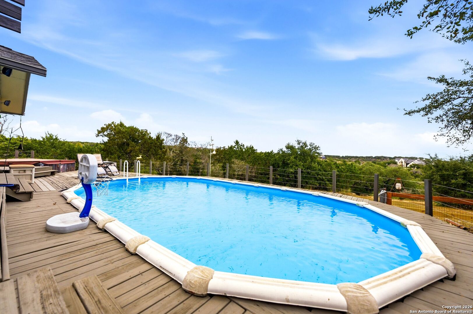 27150 Karsch Road Boerne, TX 78006 - Photo 43 of 79 a view of a swimming pool with a lounge chair
