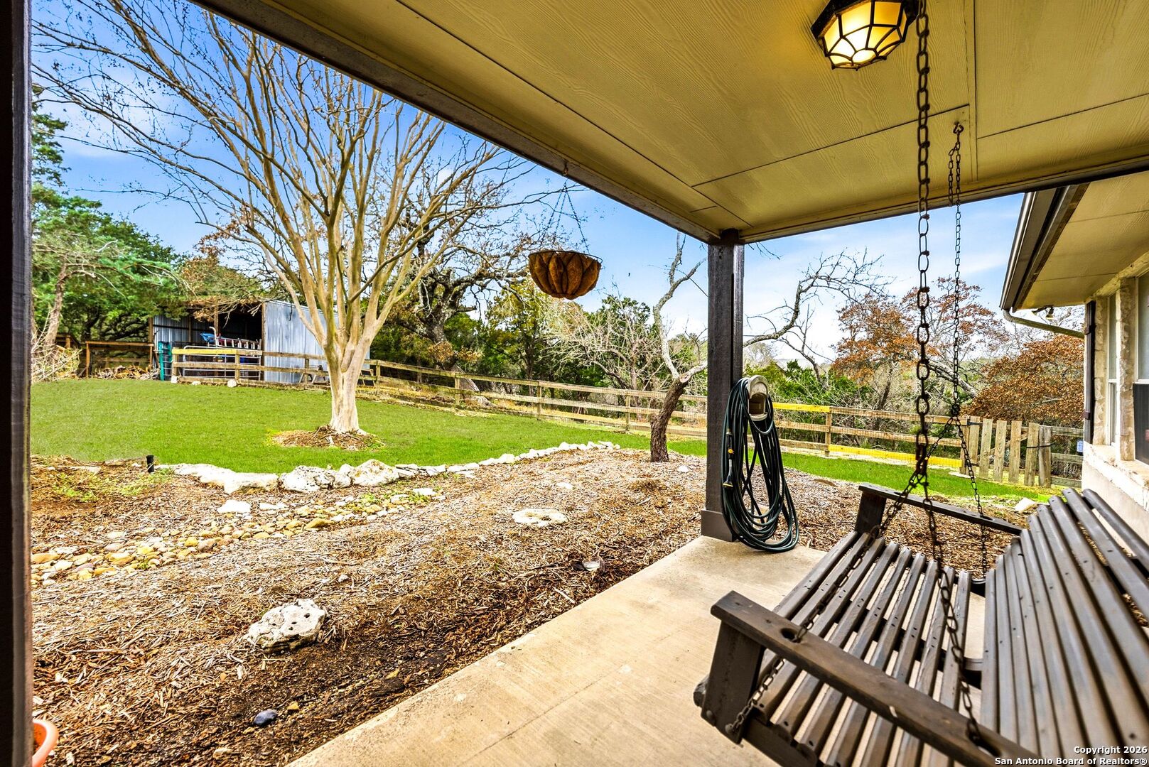 27150 Karsch Road Boerne, TX 78006 - Photo 5 of 79 a view of a patio with a table chairs and a patio