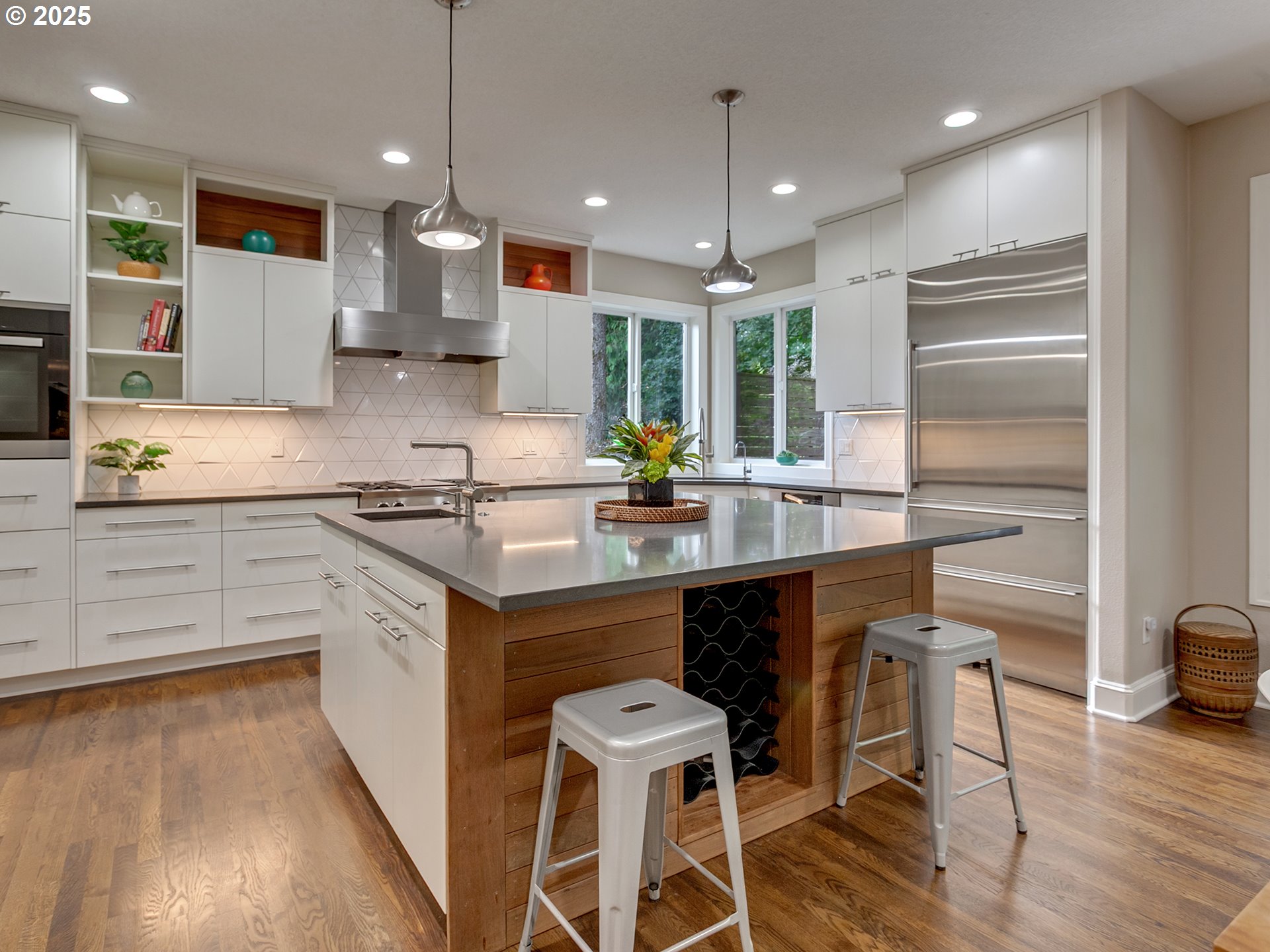 16870 Southwest Red Rock Way Beaverton, OR 97007 - Photo 15 of 45 a kitchen with stainless steel appliances kitchen island granite countertop a sink and cabinets