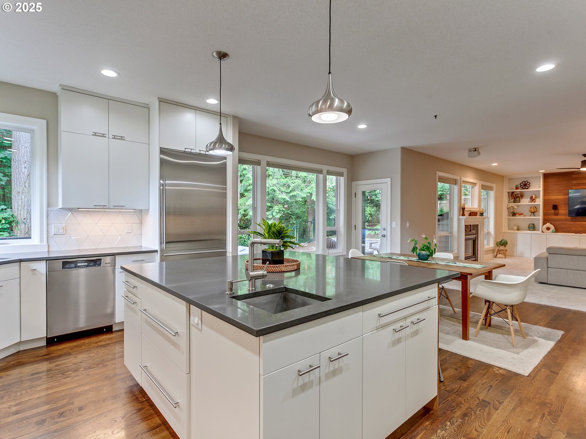 16870 Southwest Red Rock Way Beaverton, OR 97007 - Photo 16 of 45 a kitchen with stainless steel appliances granite countertop a sink a stove and refrigerator