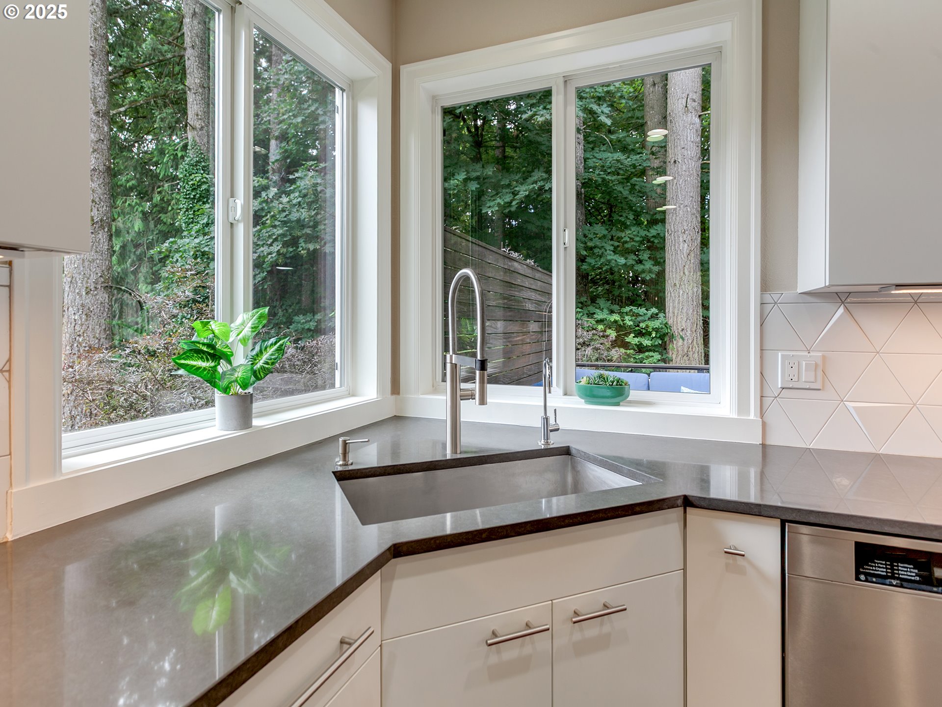 16870 Southwest Red Rock Way Beaverton, OR 97007 - Photo 17 of 45 a kitchen with sink and large window