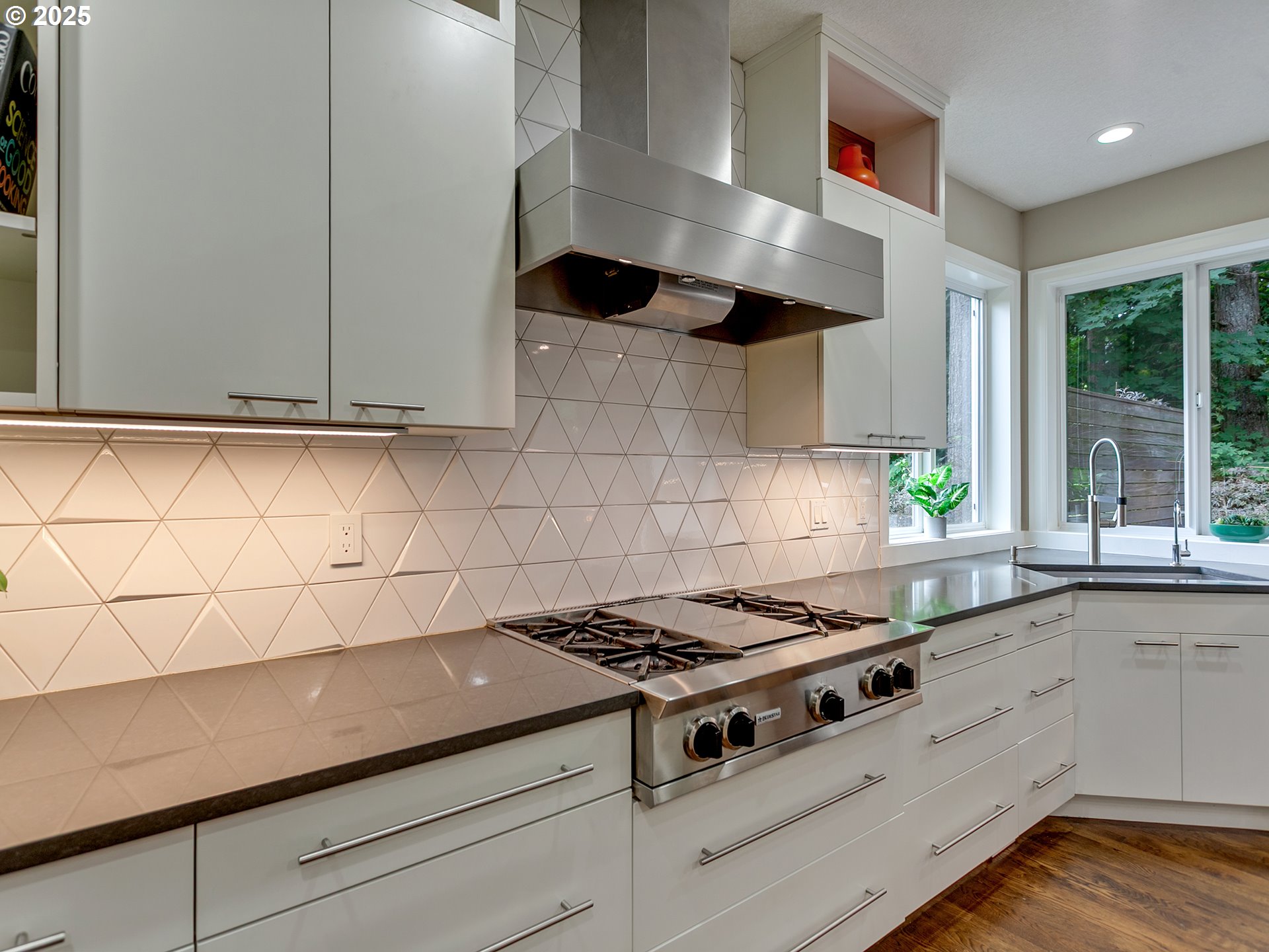 16870 Southwest Red Rock Way Beaverton, OR 97007 - Photo 19 of 45 a kitchen with granite countertop a stove and a sink
