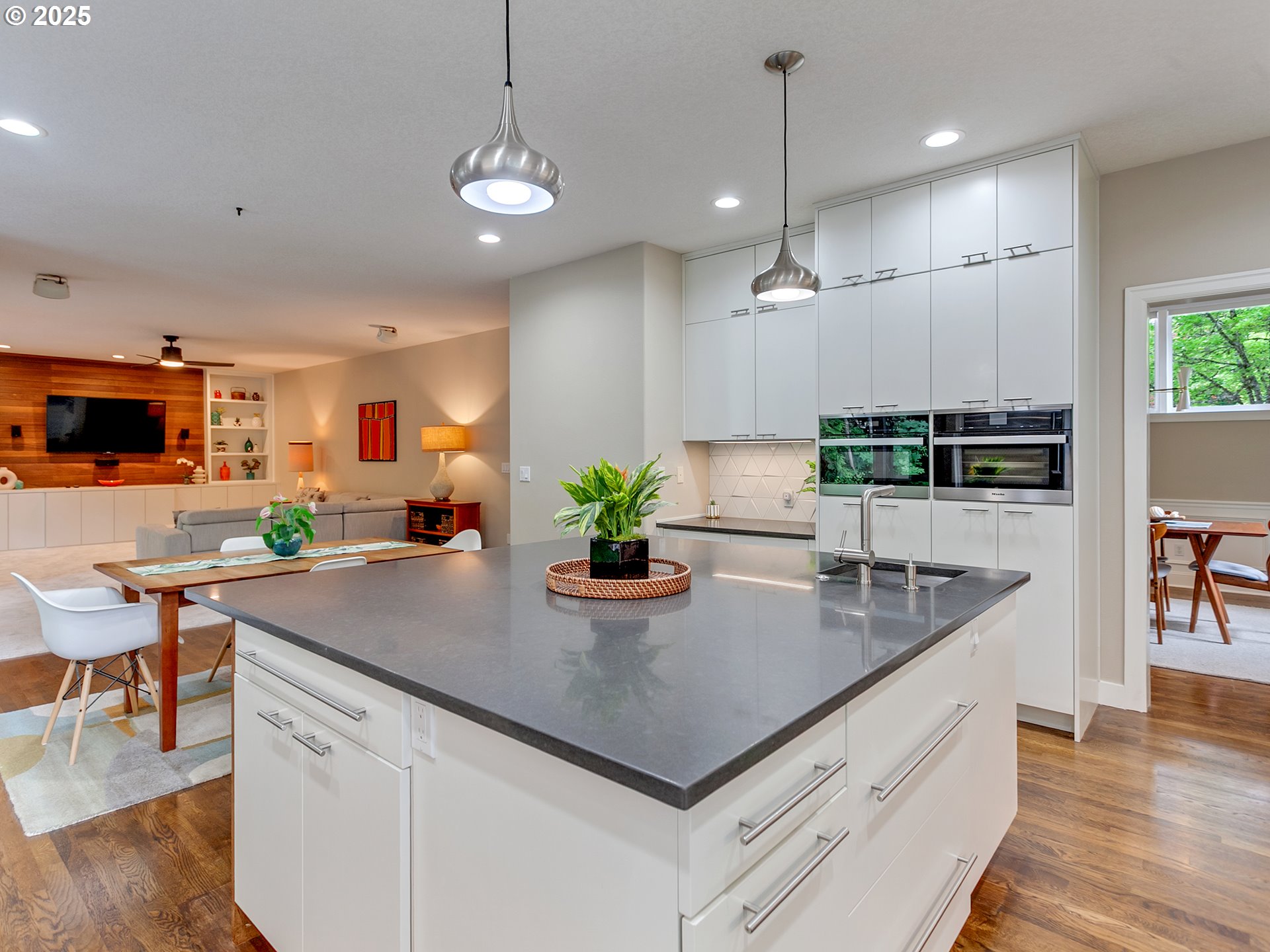 16870 Southwest Red Rock Way Beaverton, OR 97007 - Photo 20 of 45 a kitchen with kitchen island granite countertop a sink a counter top space appliances and cabinets