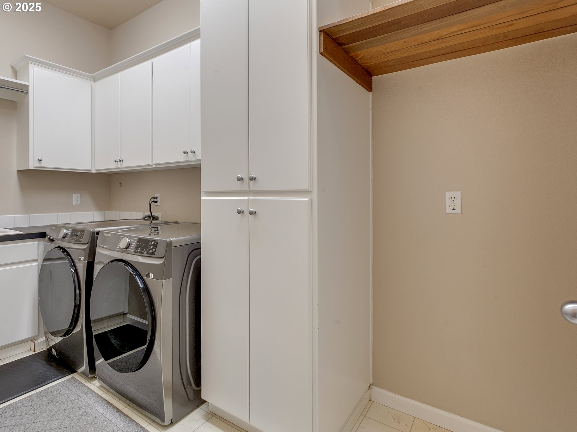 16870 Southwest Red Rock Way Beaverton, OR 97007 - Photo 24 of 45 a utility room with dryer and washer