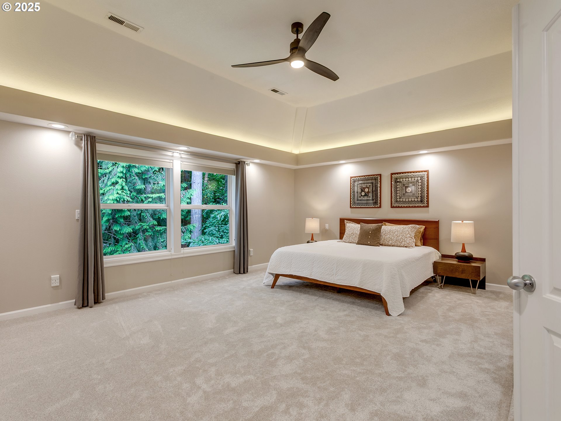 16870 Southwest Red Rock Way Beaverton, OR 97007 - Photo 26 of 45 a spacious bedroom with a bed and large window