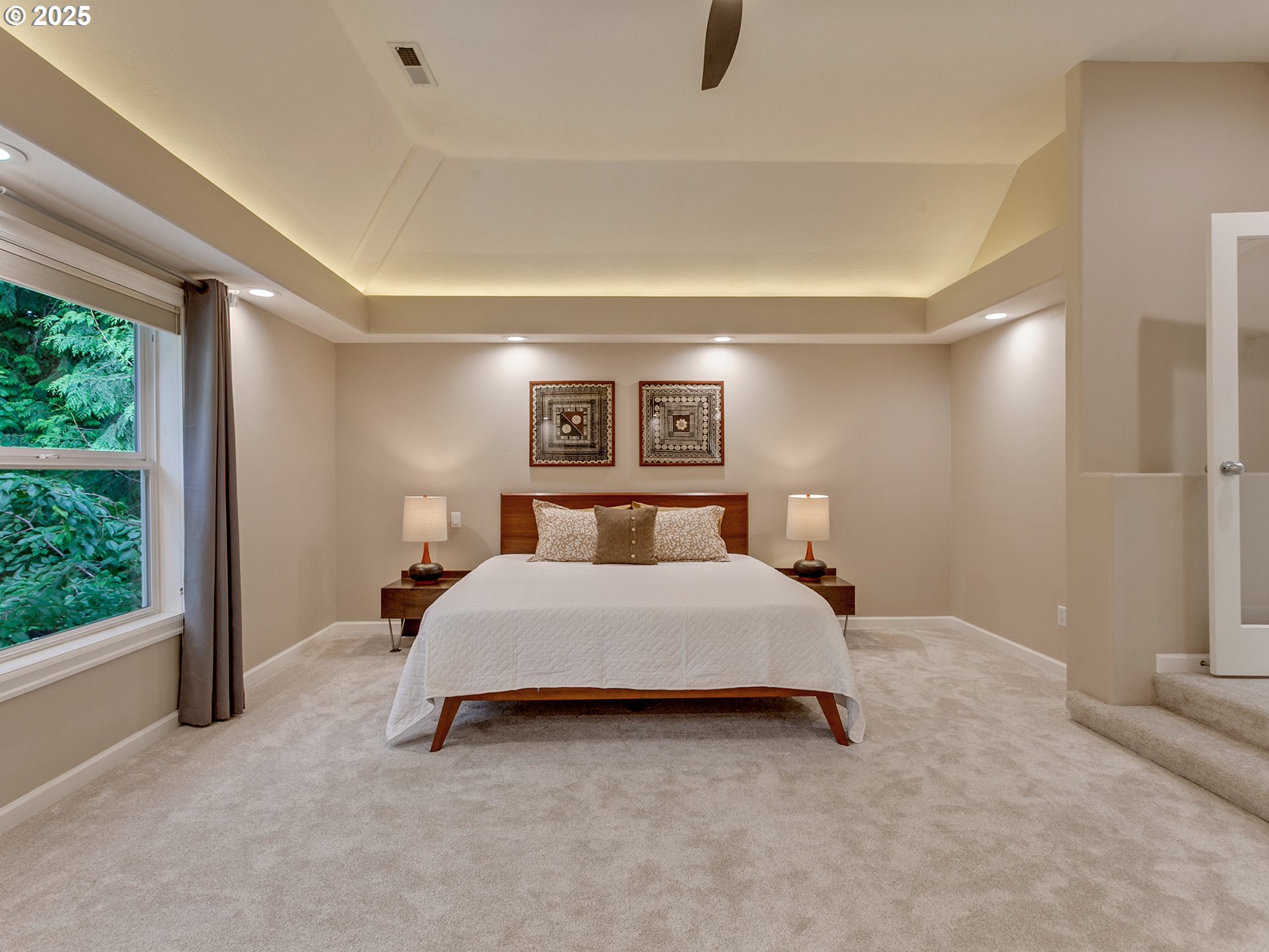 16870 Southwest Red Rock Way Beaverton, OR 97007 - Photo 27 of 45 a spacious bedroom with a bed and a window