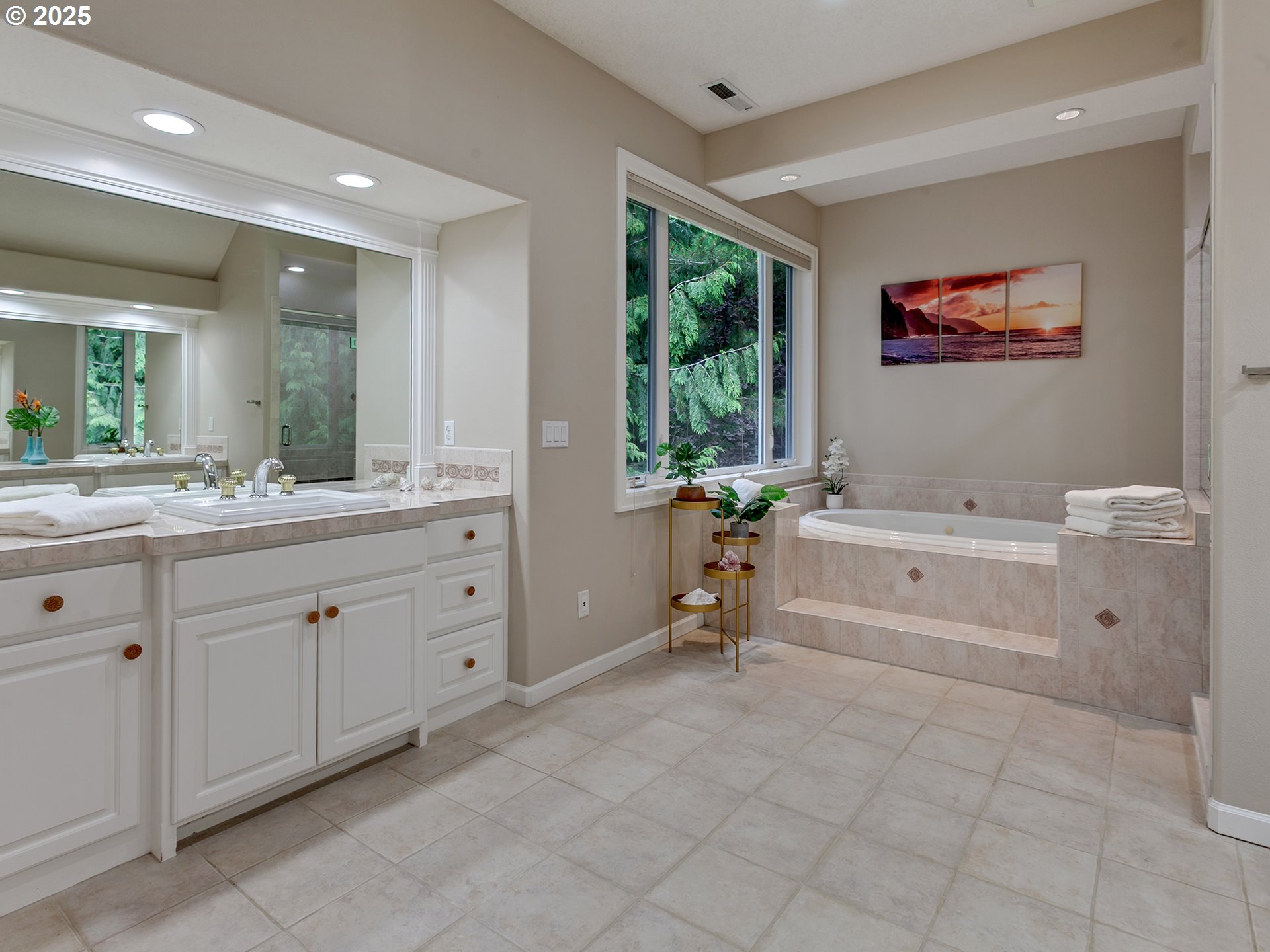 16870 Southwest Red Rock Way Beaverton, OR 97007 - Photo 29 of 45 a spacious bathroom with a tub sink and mirror