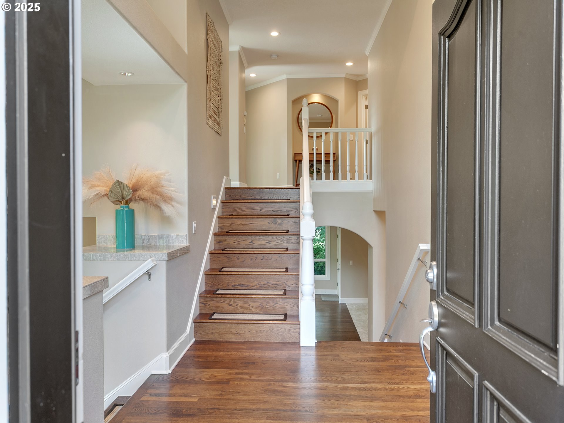16870 Southwest Red Rock Way Beaverton, OR 97007 - Photo 3 of 45 a view of entryway and hall with wooden floor