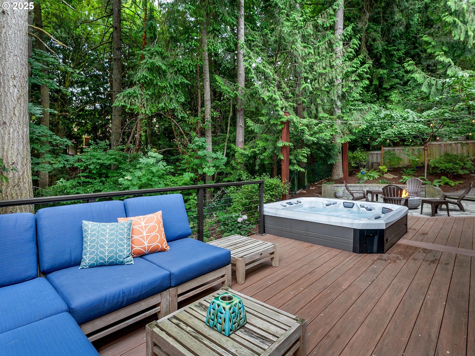 16870 Southwest Red Rock Way Beaverton, OR 97007 - Photo 38 of 45 a view of a patio with couches table and chairs with wooden floor and fence