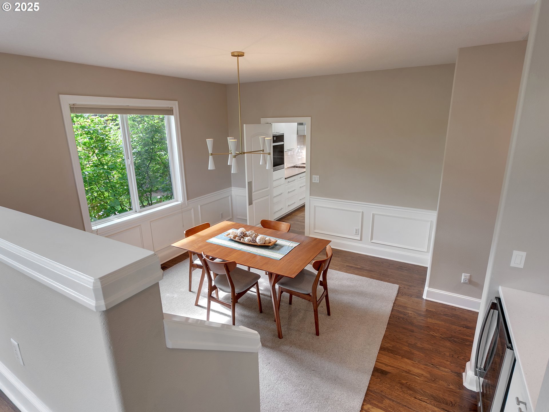 16870 Southwest Red Rock Way Beaverton, OR 97007 - Photo 6 of 45 a view of a dining room with furniture and wooden floor