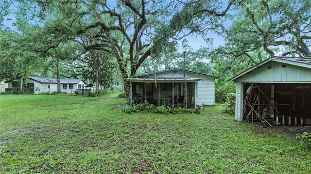 a view of house with yard and entertaining space