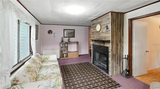 a bedroom with furniture and a fireplace