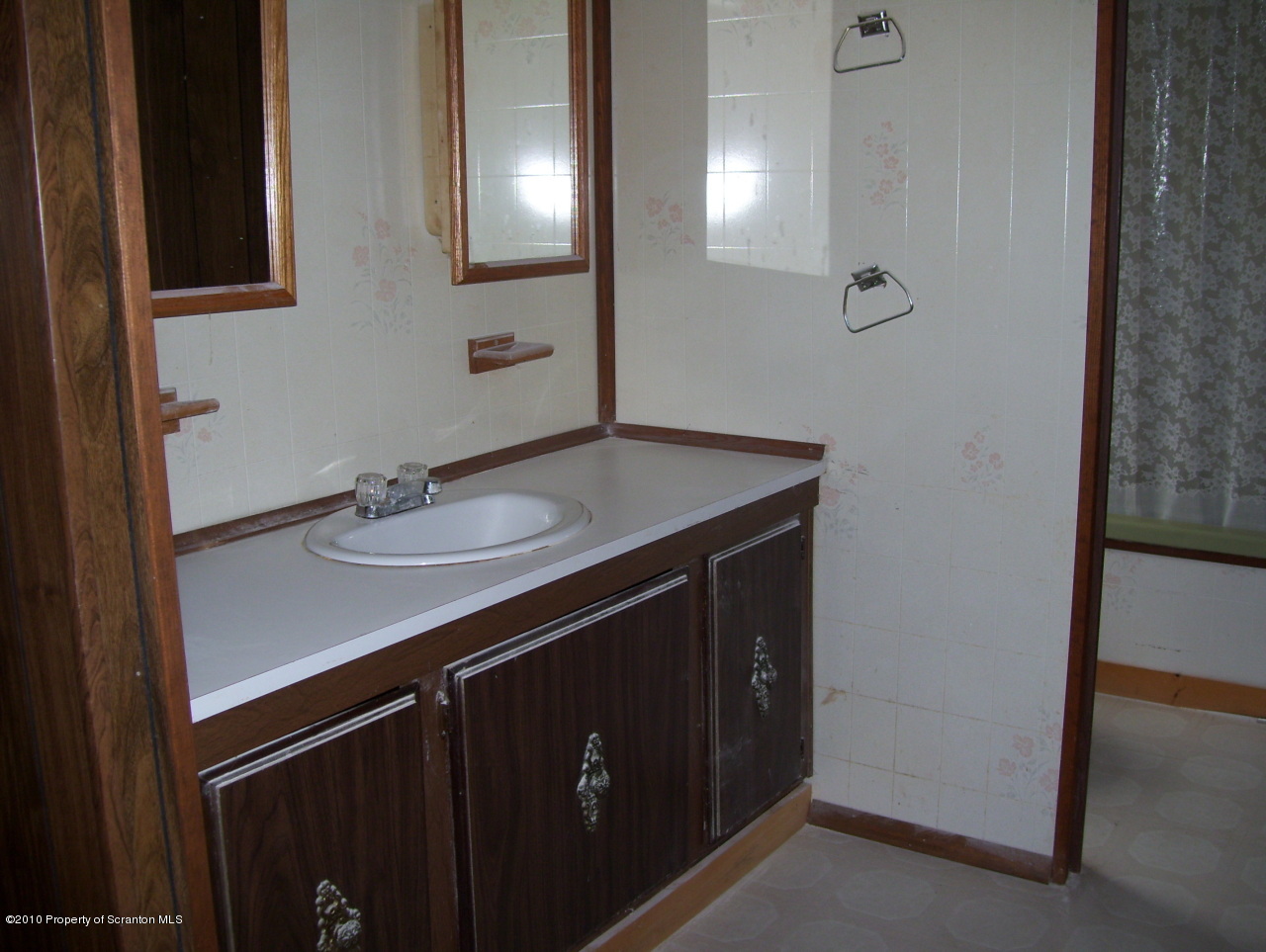 257 Rr 2 Rattle Snake Hill Meshoppen, PA 18630 - Photo 3 of 10 a bathroom with a sink vanity and mirror