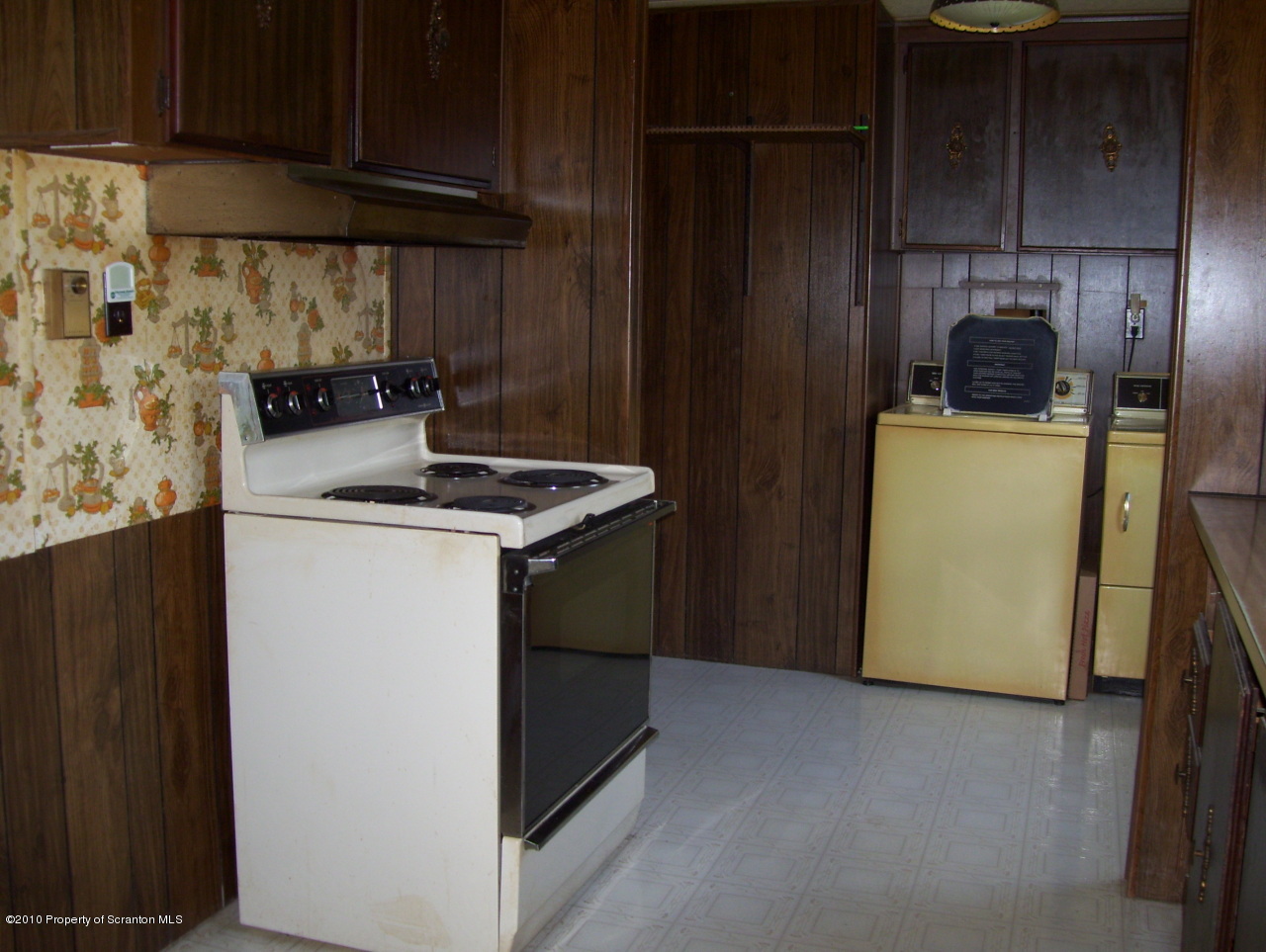 257 Rr 2 Rattle Snake Hill Meshoppen, PA 18630 - Photo 5 of 10 a kitchen with a refrigerator sink and cabinets
